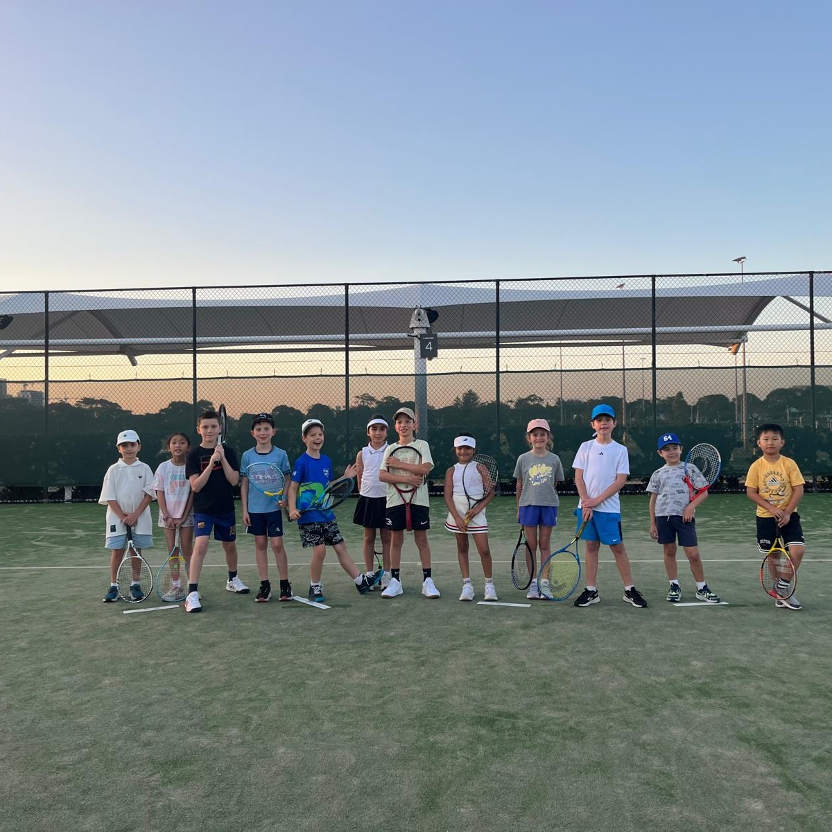 Kids on court during a Hot Shots tennis session at Heffron Park